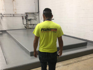 PAINTech employee in a facility. How to Budget for Facility Maintenance and Repairs