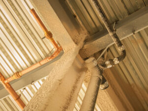 Fireproofed steel beams in a facility. Why Fireproofing Steel Beams in Your Commercial Property Is Essential